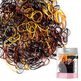 Extra strong mini rubber bands in a pile with bag of hair ties