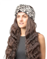 Woman wearing faux fur leopard print headband for winter & autumn.