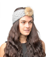 Woman wearing faux fur pom pom headband