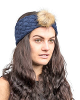 Woman wearing faux fur pom pom headband from Autumn & Winter accessory collection