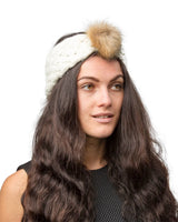 Faux fur pom pom headband with woman wearing white headband