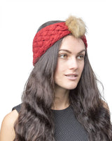 Woman wearing faux fur pom pom knitted headband - Autumn/Winter accessory.