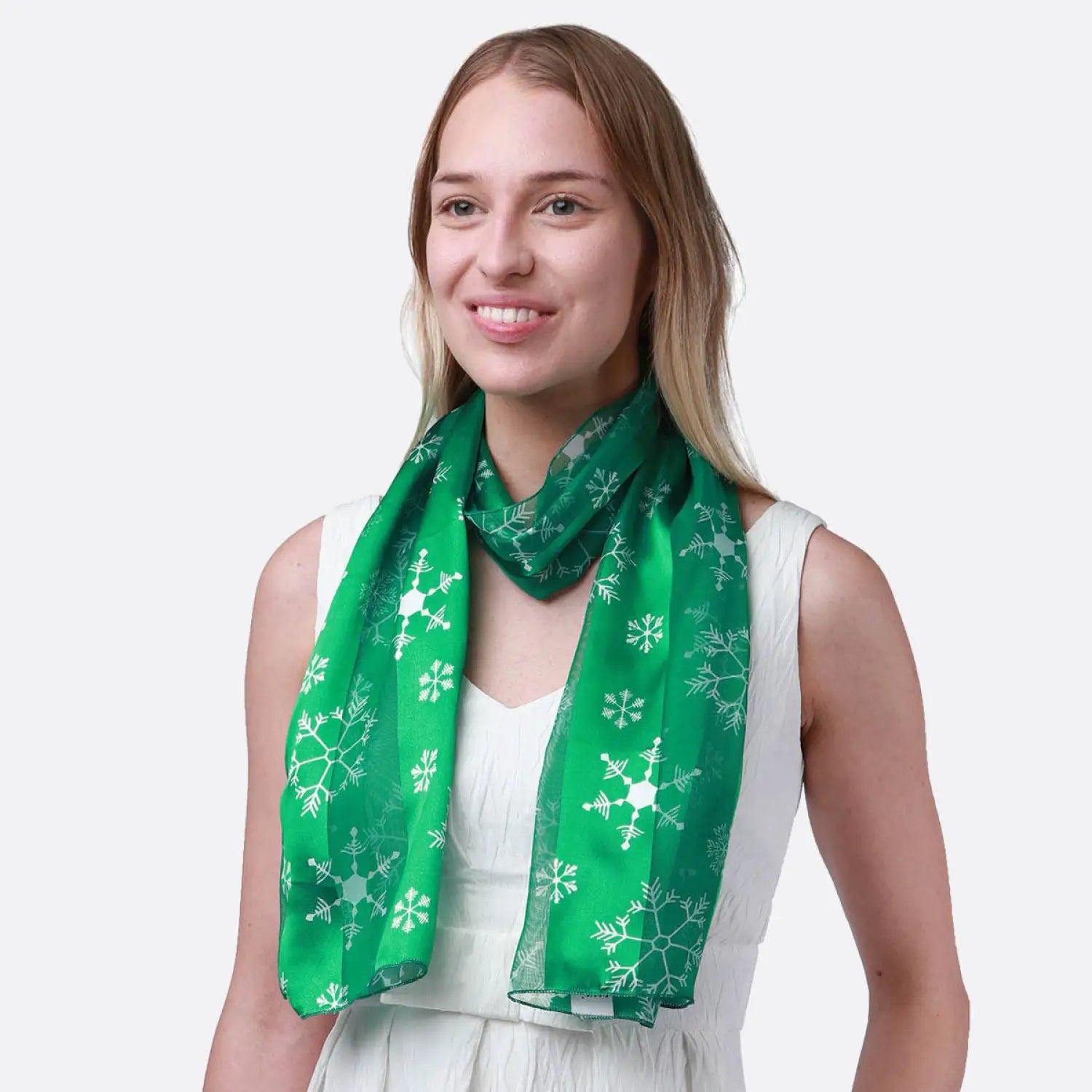 Woman wearing green satin stripe Christmas scarf with white flowers.