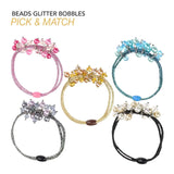 Elegant beaded metallic elastic hair bands with floral design.