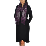 Woman wearing purple scarf and black dress with floral embroidered soft scarf featuring fringed trims
