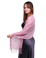 Woman wearing pink floral lace tassel shawl.