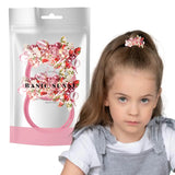 Little girl wearing pink flower hair clip from Flower Fabric Bobbles with Facet Beads - 2PCS Set.
