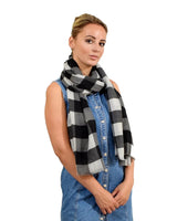 Woman wearing black and white gingham check print oversized scarf