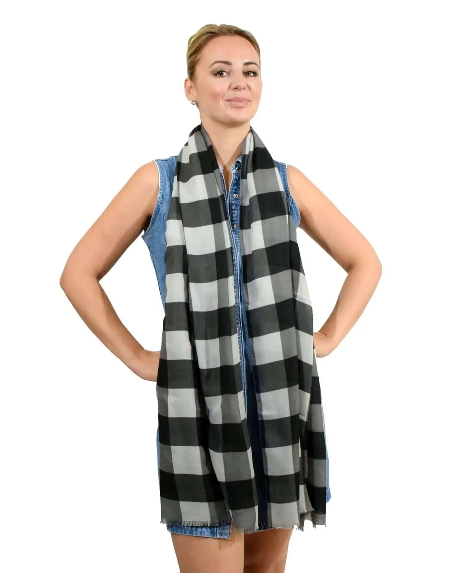 Woman wearing gingham check print scarf.