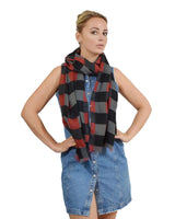 Woman wearing black and red gingham check print scarf.