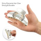 White diamond ring held in hand representing Glamorous Rhinestone Butterfly Hair Clamps
