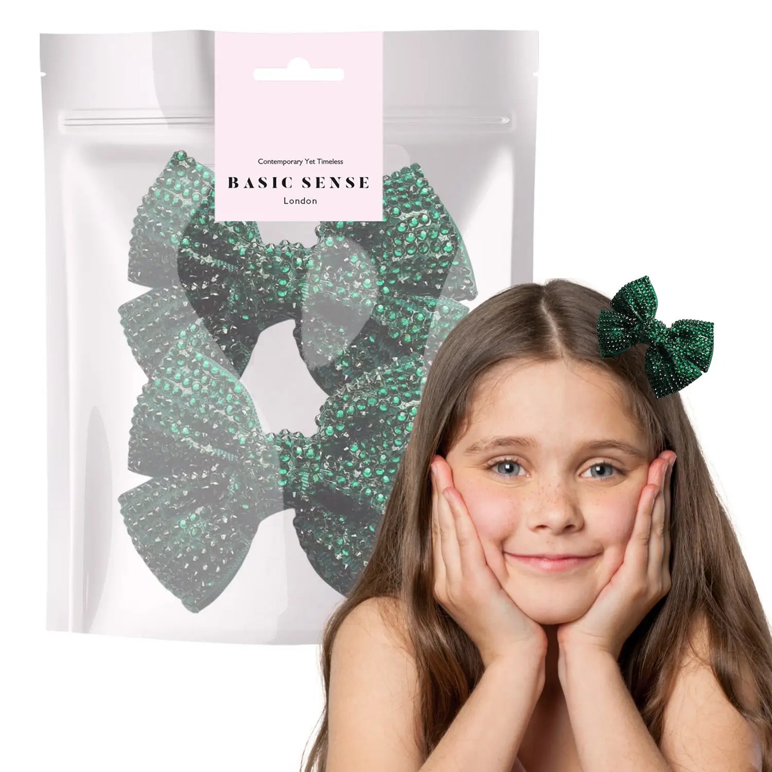 Young girl with hands on face holding bag of rhinestone ribbon alligator hair clips.
