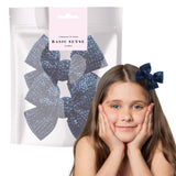 Girl wearing blue bow hair clip from Glamorous Rhinestone Ribbon Alligator Hair Clips - 2 Pack