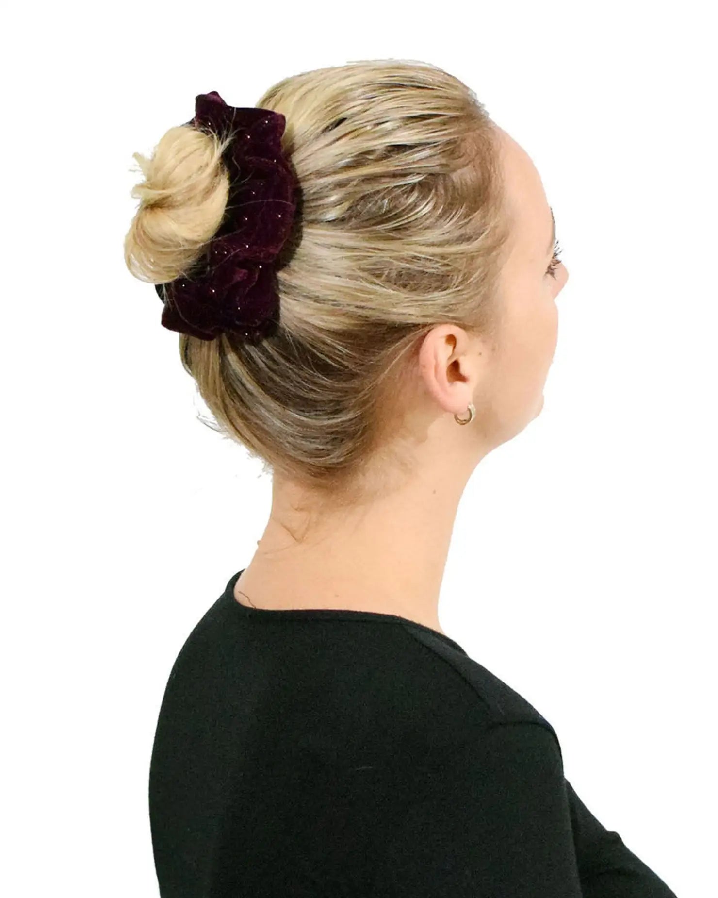 A woman wearing a burgundy velvet flower in her blonde hair from Glitter Velvet Hair Scrunchie Set.