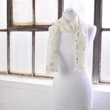 White mannequin with gold foil on Gold Foil Music Instrument Chiffon Scarf.