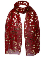 Gold foil music note chiffon scarf in red with musical notes design.