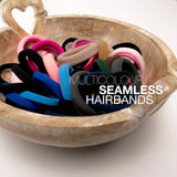 Colorful hair ties in a wooden bowl by Hair Elastics Tie