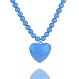 Blue heart charm ball chain necklace with silver clasp on display