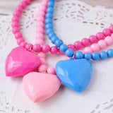 Pink and blue heart charm ball chain necklace.