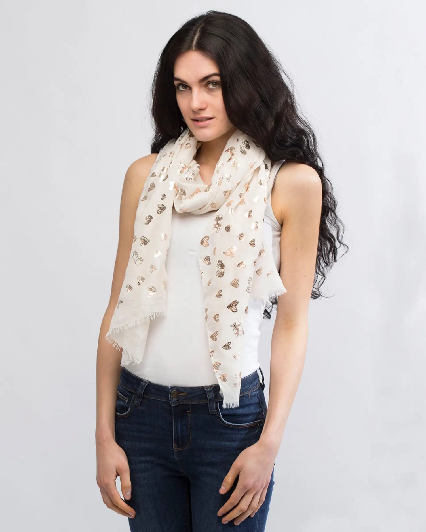 Woman wearing white floral pattern scarf from Heart & Cow Print Silver Foil Oversized Scarf