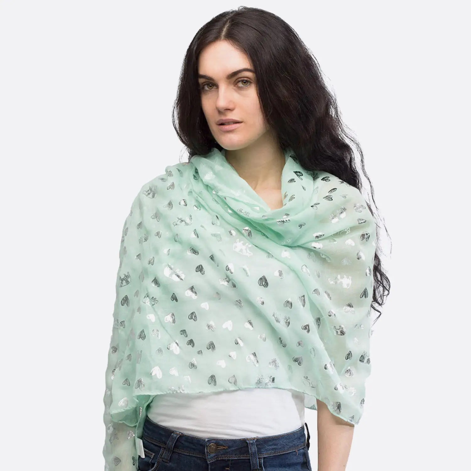 Oversized green scarf with cow print design on silver foil fabric