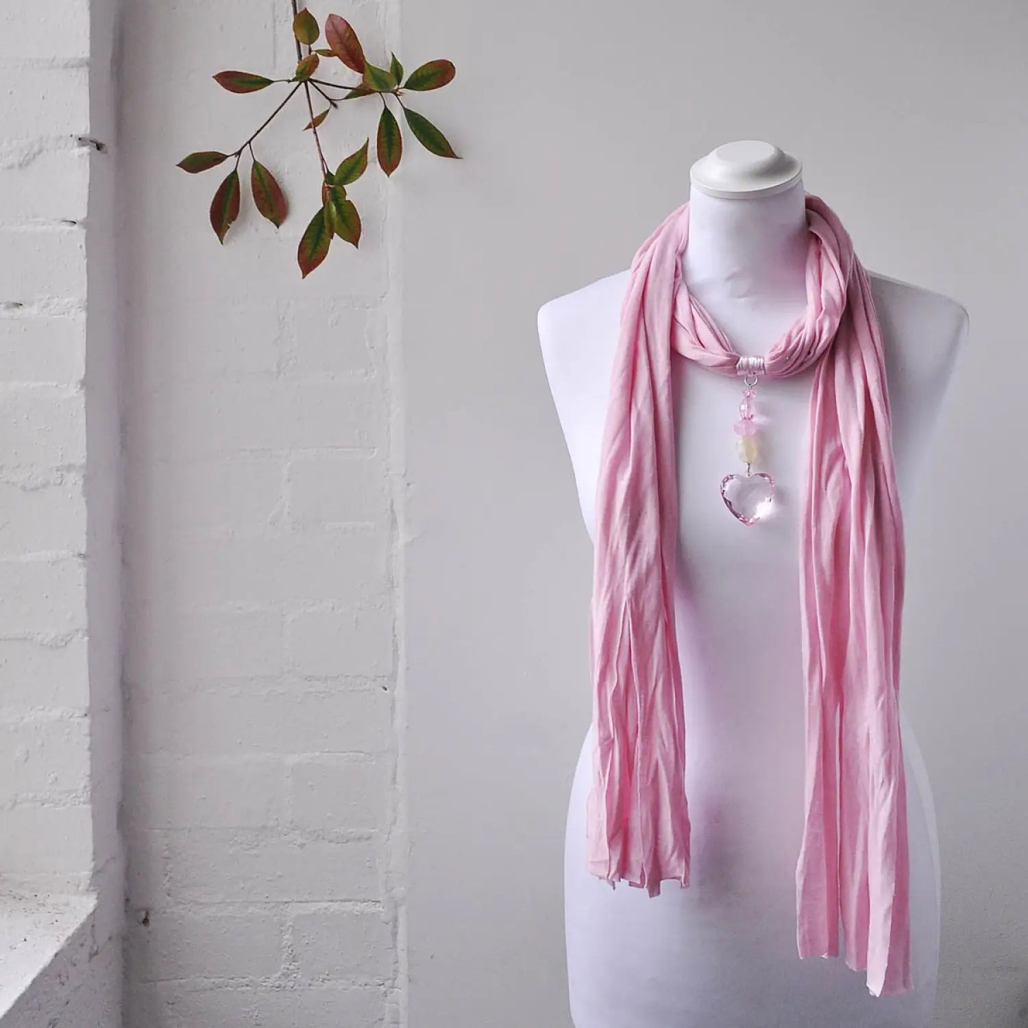 Pink Heart Pendant Jewellery Scarf draped on a mannequin