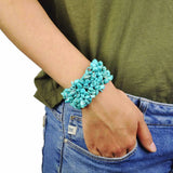Howlite turquoise stone bangle bracelet on woman’s wrist