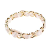 Imitation pearl and peach ribbon stackable gold bracelet - product showcase.