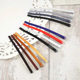Set of 12 jumbo metal bobby pins in different colored leather hair clips