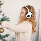 Little girl decorating a Christmas tree while wearing Kids Panda & Cat Animal Earmuff Duo.