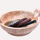 PU leather braided headbands in wooden bowl on white background