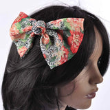 Woman wearing floral print hair bow clip accessory