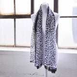 Leopard print chiffon scarf with chain border on mannequin display
