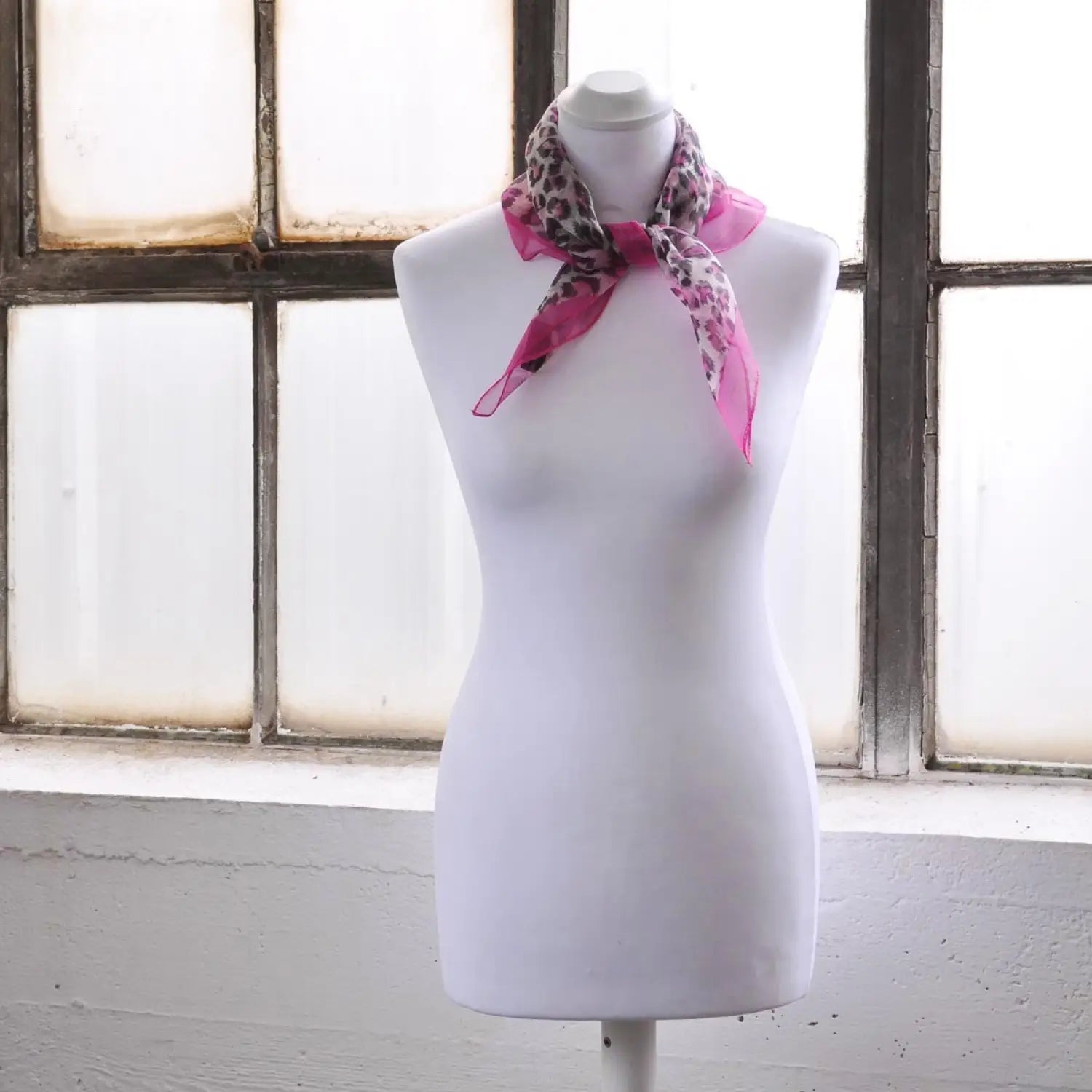 White mannequin wearing Leopard Print Chiffon Square Neck Scarf.