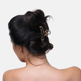 Leopard print hair claw set with woman wearing hair clip.