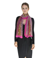 Woman wearing a leopard print silk blend chiffon scarf