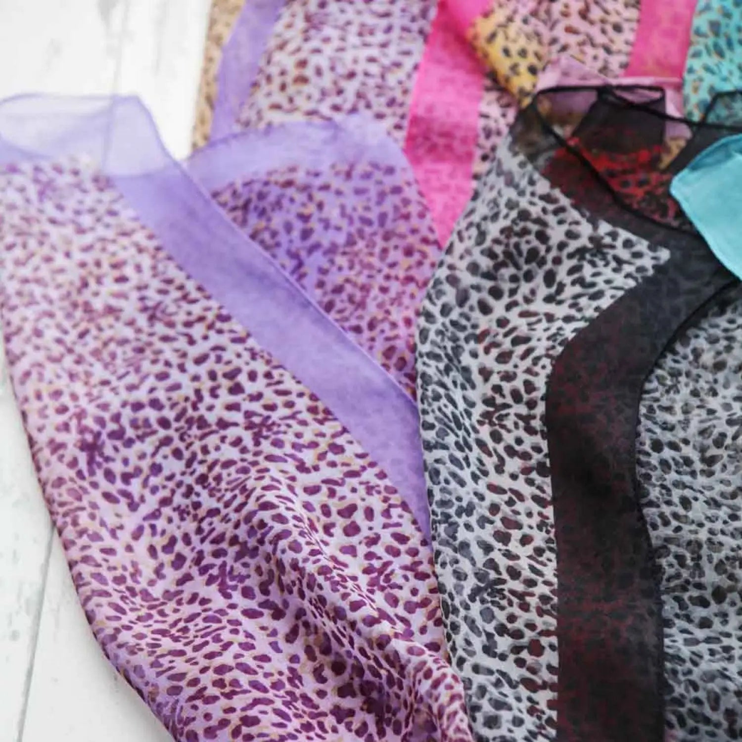 Close-up of purple leopard print tie-dye silk blend chiffon scarf
