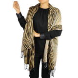 Woman wearing zebra print tasselled oversized scarf