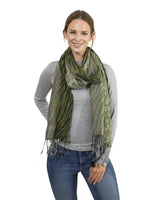 Woman wearing zebra print tasselled scarf.