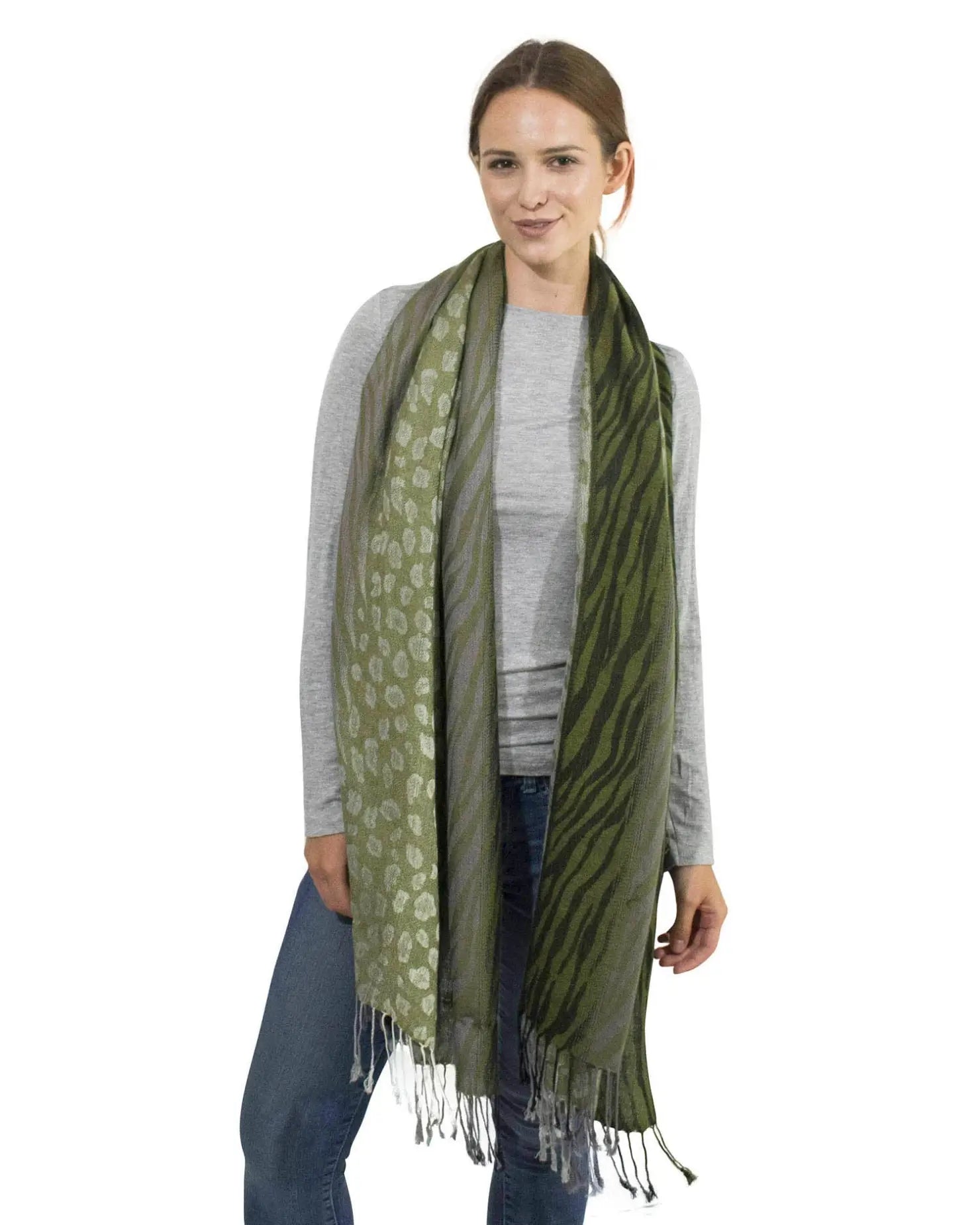 Woman wearing green leopard print tasselled scarf.