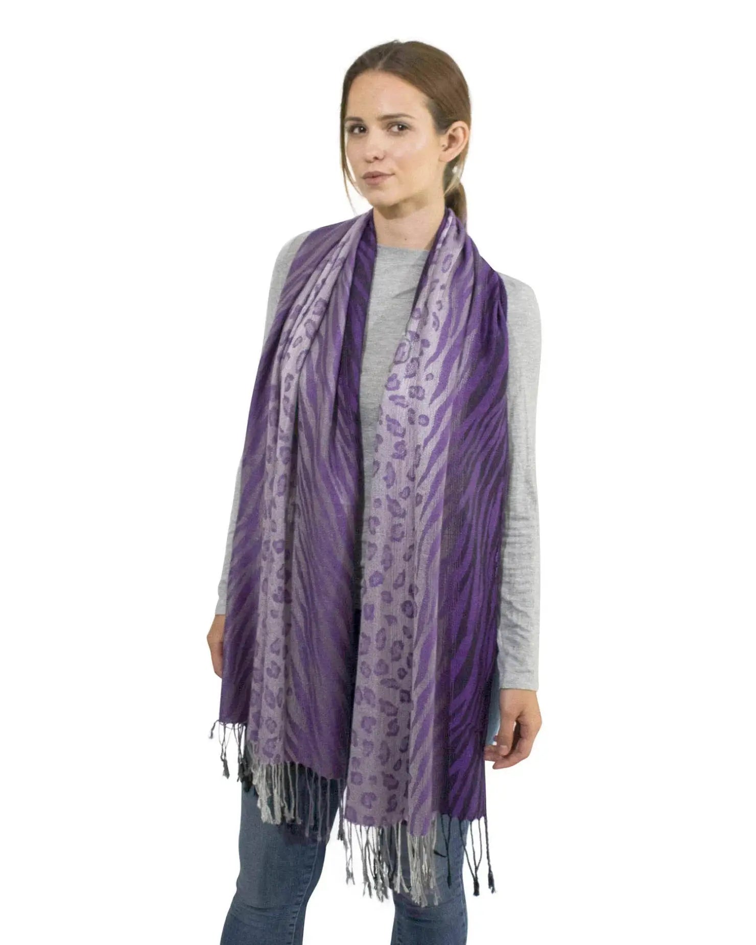 Purple leopard print tasselled scarf worn by woman
