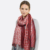 Stylish woman wearing red leopard print tasselled scarf