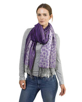Stylish woman wearing zebra print tasselled oversized scarf