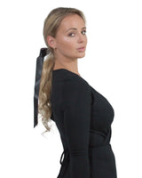 Long double satin bow hair comb on woman in black dress