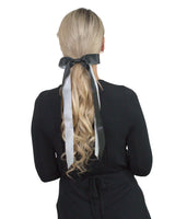 Blonde woman in black and white bow hair accessory