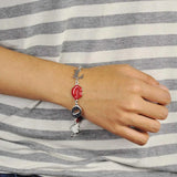 Woman wearing red heart charm bracelet from Love Charm Rhinestone Metal Bracelet product.