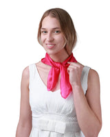 Woman in white dress and pink scarf modeling Luxurious 100% Mulberry Silk Small Square Scarf.