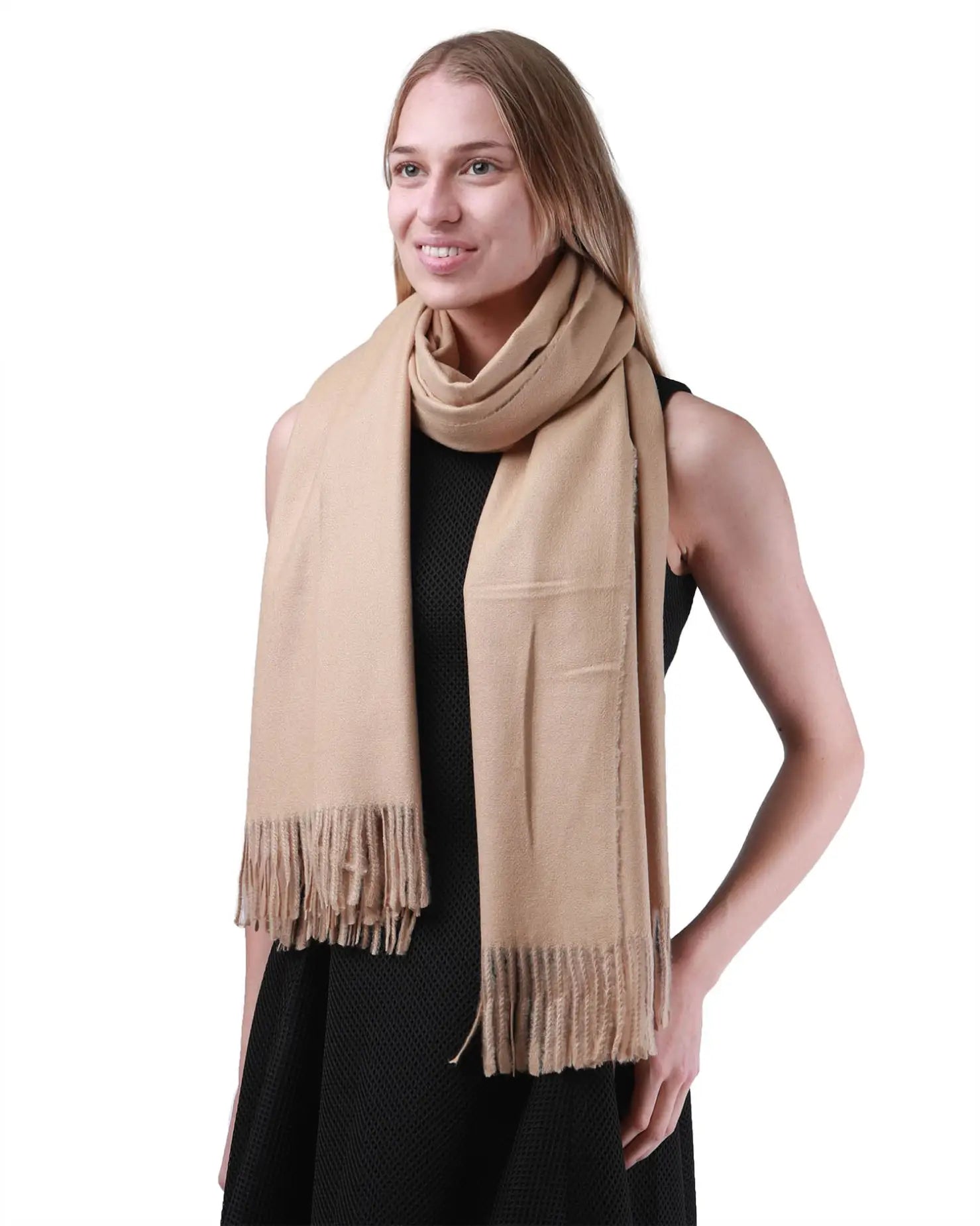 Woman wearing a tan cashmere feel oversized scarf