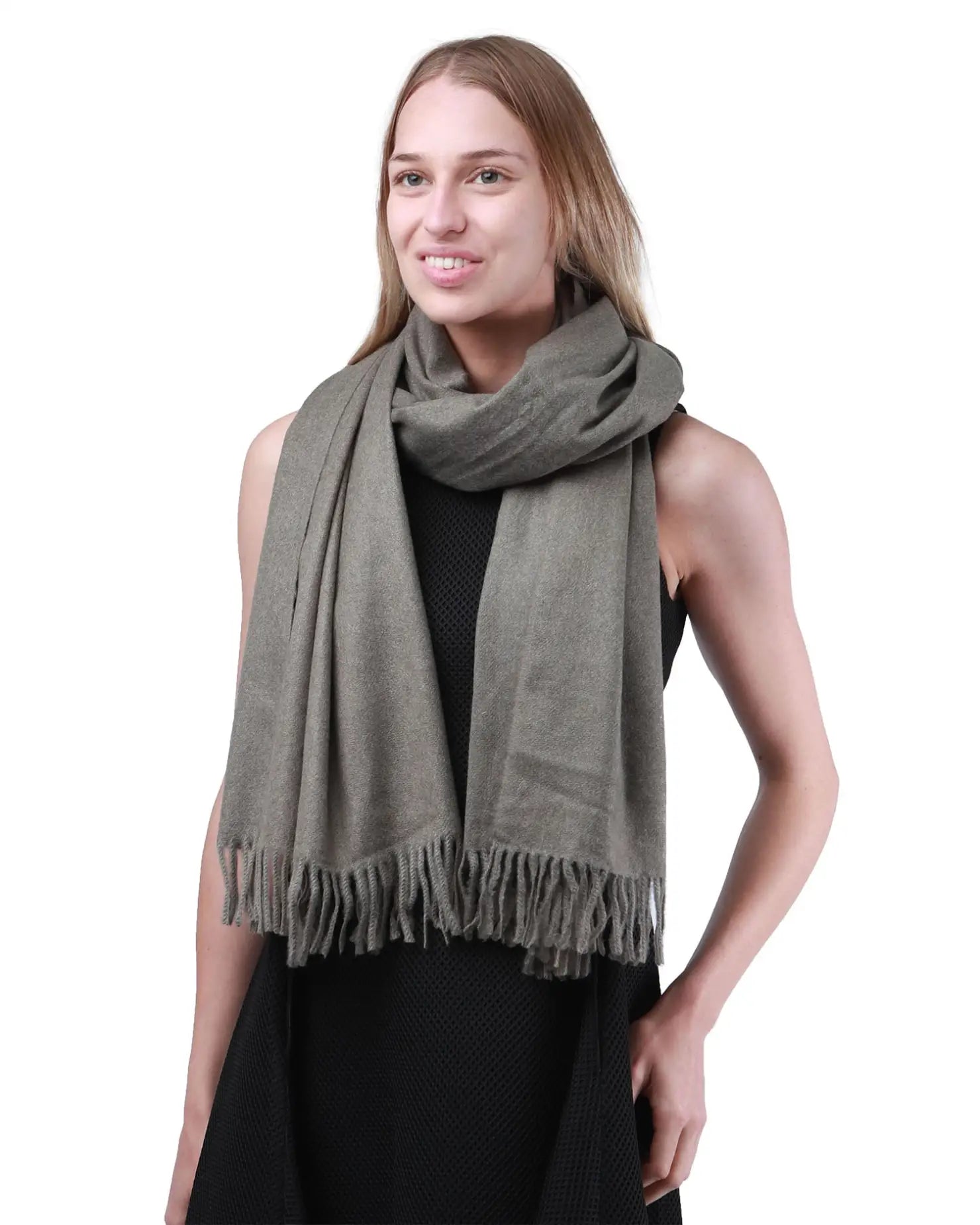 Luxurious cashmere feel oversized scarf worn by a woman