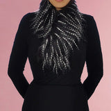 Woman wearing luxurious faux fur autumn winter wrap stole scarf with black feather detail.